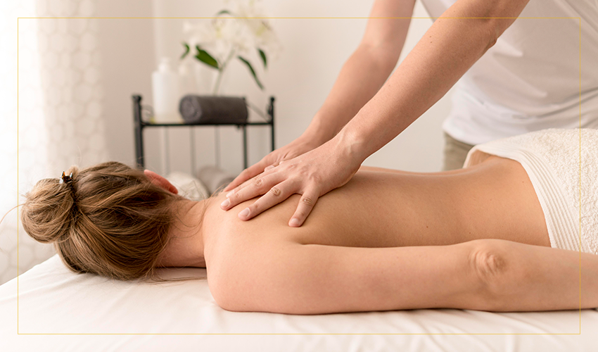 Woman receiving massage, face down